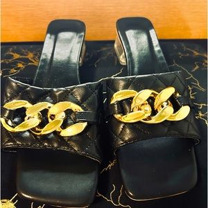 Black and gold mules with clear heel
